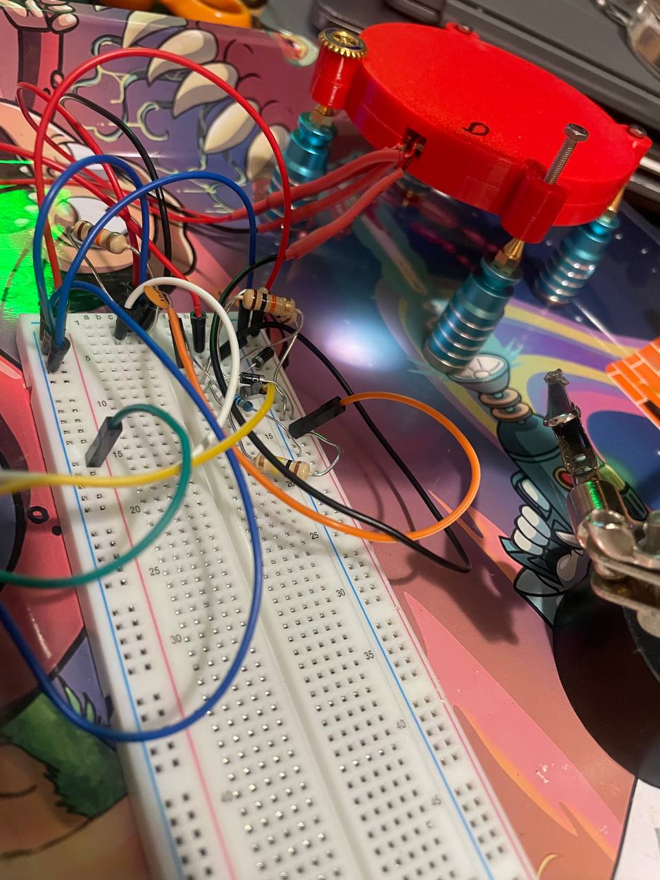 The POP crystal disc, temporary enclosure, breadboard, and resonator wiring on the bench